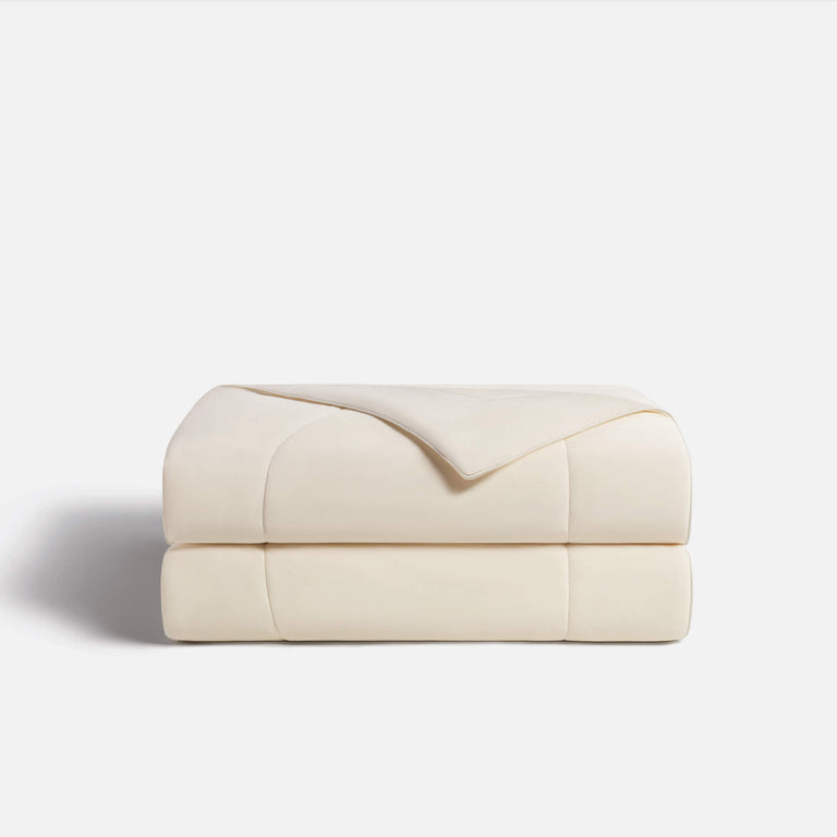 Woman enjoying Lullabee Cooling Comforter for night sweats and hot flashes