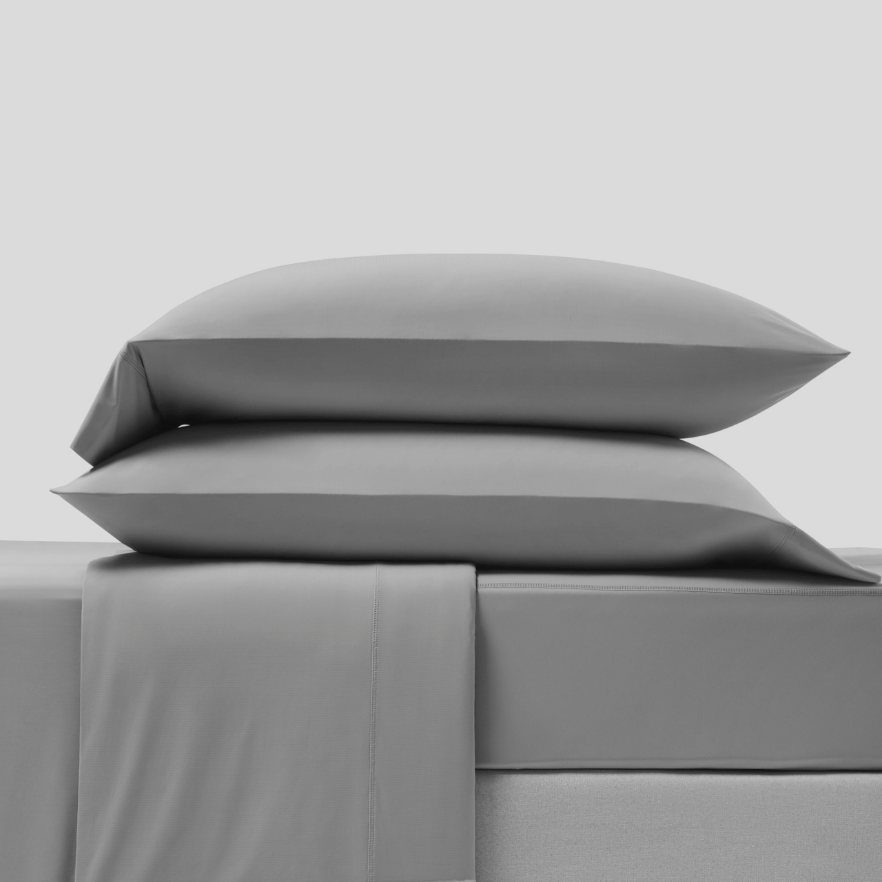 Full gray CoolingCode™ bedding set arranged in a serene bedroom, promoting a refreshed morning wake-up