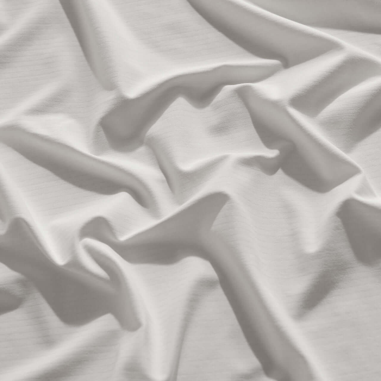 CoolingCode™ fitted sheet texture showing soft, breathable fabric for ultimate comfort and pet-friendly use.