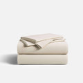 CoolingCode™ Sheet Bundle: Fitted sheet and pillowcases in soft beige, showcasing comfort and machine wash convenience.